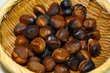 roasted chestnuts on a white background, winter