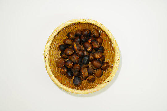 roasted chestnuts on a white background, winter