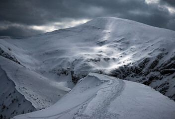 Sun, shadows and clouds over Tatra Mountains in Poland