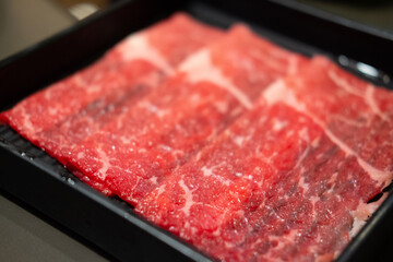 Premium fresh and raw pork and beef meat prepared for Japanese sukiyaki