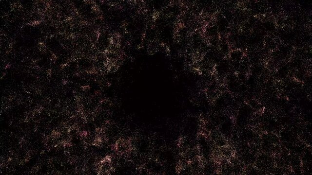 animation of an explosion of colored particles on a dark background with physics.