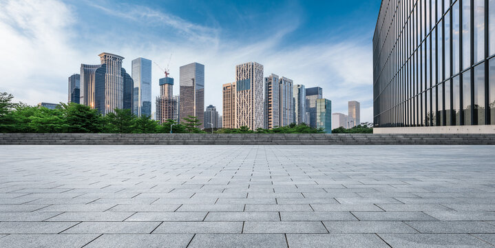Fototapeta Panoramic skyline and modern commercial office buildings with empty road. empty square floors and cityscape.