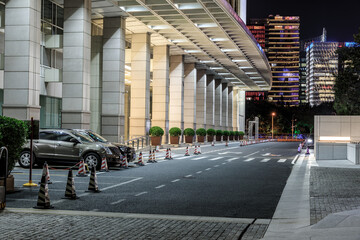 Asphalt road and modern commercial building landscape in Shanghai, China.