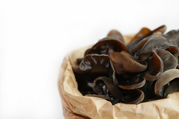 Fresh wood ear nushroom on white background,raw material for cooking. Close up.