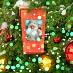Red lantern with the image of Santa Claus on the Christmas tree