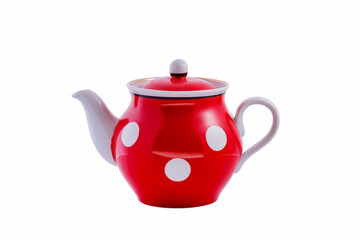 Ceramic vintage red teapot with white polka dots isolated on white background. Copy space.
