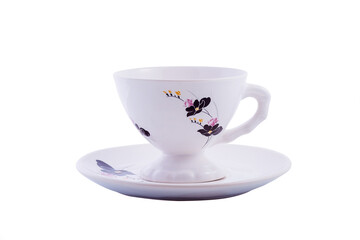 Ceramic white chinese cup on saucer with floral ornament isolated on white background. Copy space.