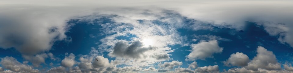 Obraz premium Blue sky panorama with Cirrus clouds in Seamless spherical equirectangular format. Full zenith for use in 3D graphics, game and editing aerial drone 360 degree panoramas for sky replacement.