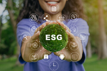 ESG icon concept in the woman hand for environmental, social, and governance by using technology of...