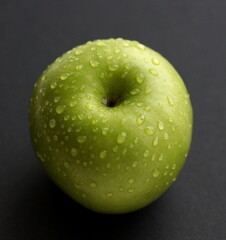 Green apple isolated on black background. Apple with water drops.	