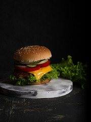 homemade burgers on a dark wooden background 