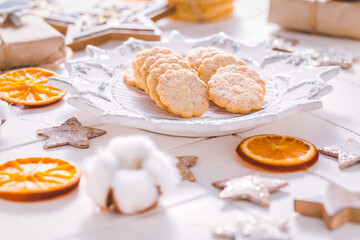 Christmas cookies with orange slices, ornaments on white background