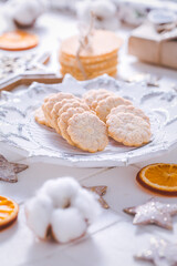 Christmas cookies with orange slices, ornaments on white background