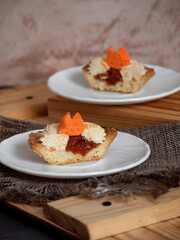 cakes with sweet cream on plates