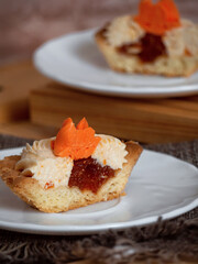 cakes with sweet cream on plates