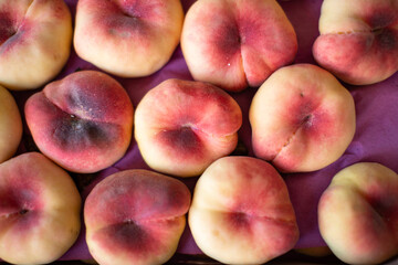 Ripe peaches close-up on the counter.