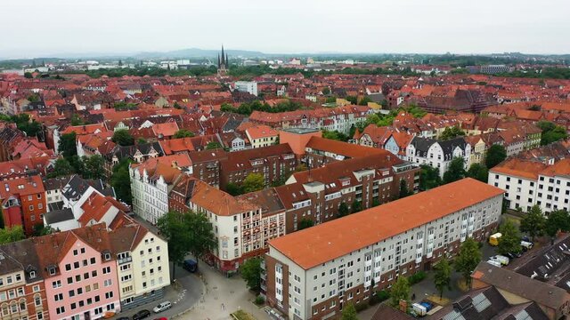 Drone flyover old town of Hanover City in Lower Saxony during daytime,German - Beautiful old buildings with red roof