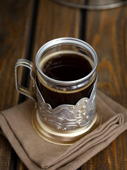 coffee in a vintage glass on a dark background