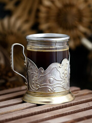 coffee in a vintage glass on a dark background