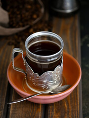 coffee in a vintage glass on a dark background