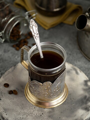coffee in vintage glass on gray background 