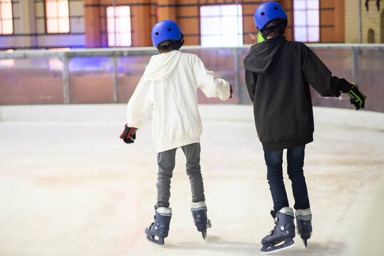 Ice skates. Slides. Women's ice skating on rink. Figure skating