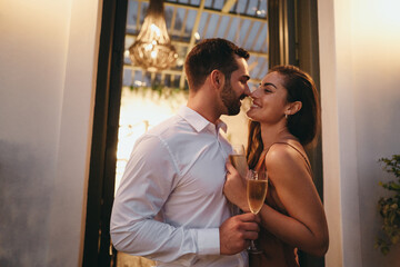 Romantic young couple flirting in a luxury hotel