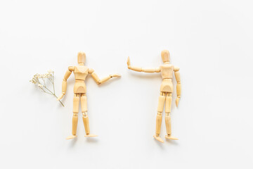 Man and woman connection. Couple of wooden mannequin figures.