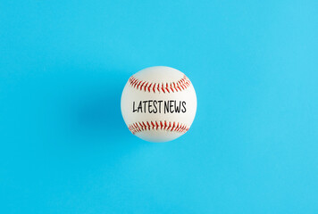 Baseball ball on blue background with the word latest news.