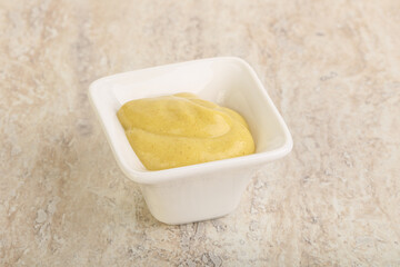 Organic mustard sauce in the bowl