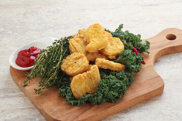 Crispy chicken nuggets with tomato ketchup