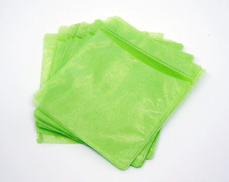 green plastic disck cover isolated on white background   