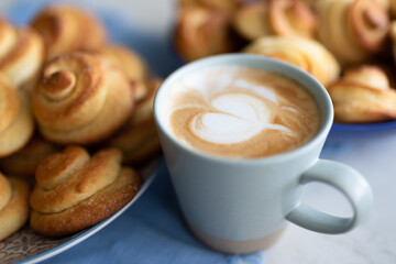 Homemade cappuccino cup with pastries
