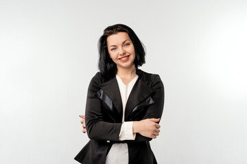 Portrait of happy young business woman with dark hair posing isolated over white wall background, wear black formal jacket white shirt