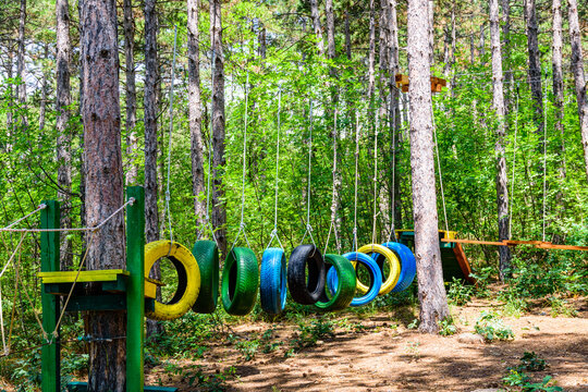 Old painted car tires at the obstacle course - Powered by Adobe