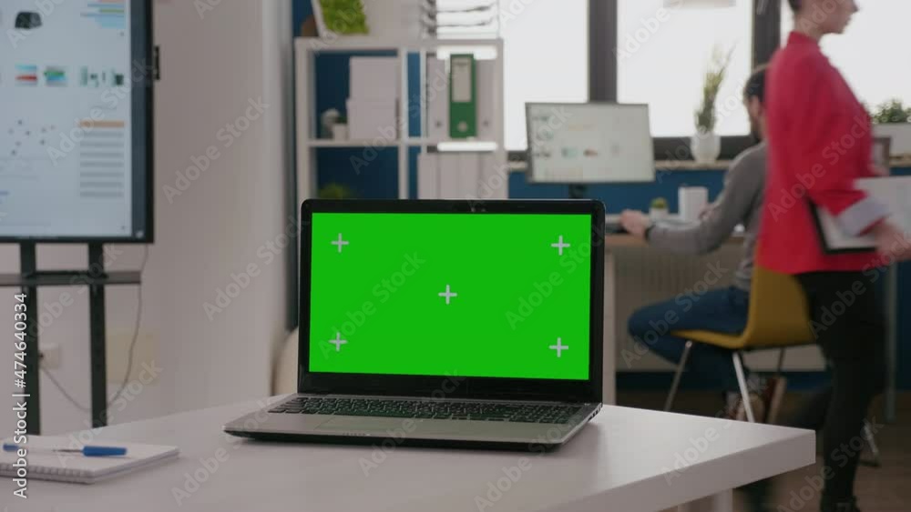 Poster close up of laptop with green screen on empty office desk. isolated template and mock up copy space 