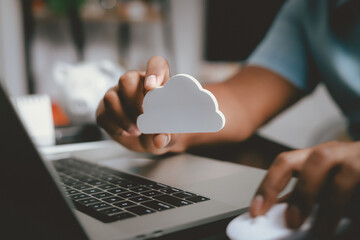 Businessmen use laptops to secure computing through cloud storage for digital business and cloud data processing management. Optimizing online business customer service
