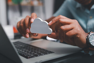 Businessmen use laptops to secure computing through cloud storage for digital business and cloud data processing management. Optimizing online business customer service
