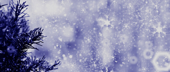 Very peri color of the year 2022. abstract winter background. Snowflakes and snow with bokeh effect.