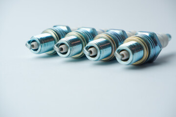 Auto parts. Car spark plugs. Spark plugs of a gasoline internal combustion engine. Space for text