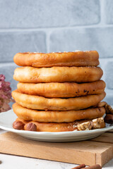 A stack of hotteok hot cakes close-up on a light background.