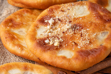 Hotteok Korean pancake stuffed with nuts, sugar and nuts. Close-up.