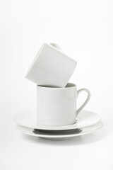 several white porcelain cup and saucer for coffee isolated on white background