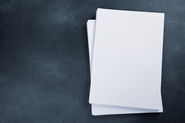 Blank flyer poster Blank flyer poster paper a4 or a5 isolated on black, place for your design mock up hollow blue tinted