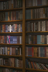 Wooden shelves with books in the cafe. Vintage style in a cafe. Library. High quality photo