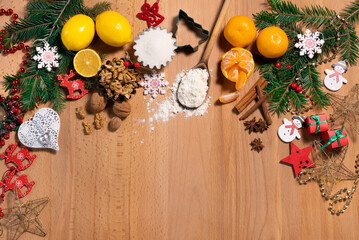 Festive Christmas decor on a wooden surface, in the middle of an empty space for an inscription, top view