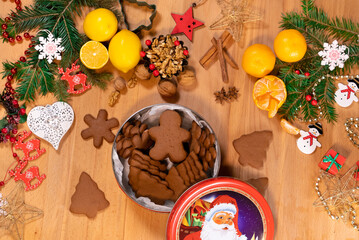 Box with Christmas gingerbread on the background of festive new year decor, top view