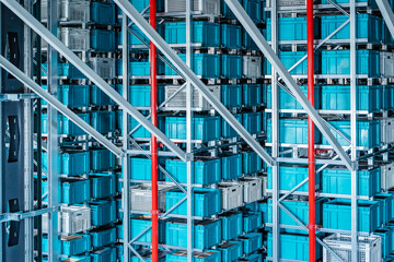 Blue containers in automatized high rack at warehouse
