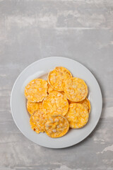 small puffed corn cakes on small white plate