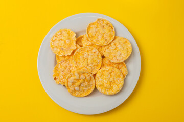 small puffed corn cakes on small white plate
